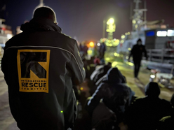 A group of refugees are put onto a boat to be returned to Libya